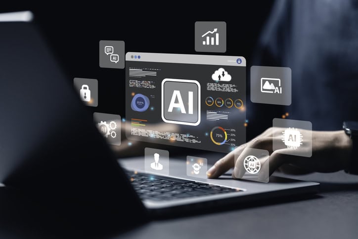 laptop displaying hologorams of ai models for development
