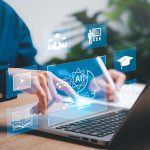 Feature image of a person using a laptop with AI concepts floating around